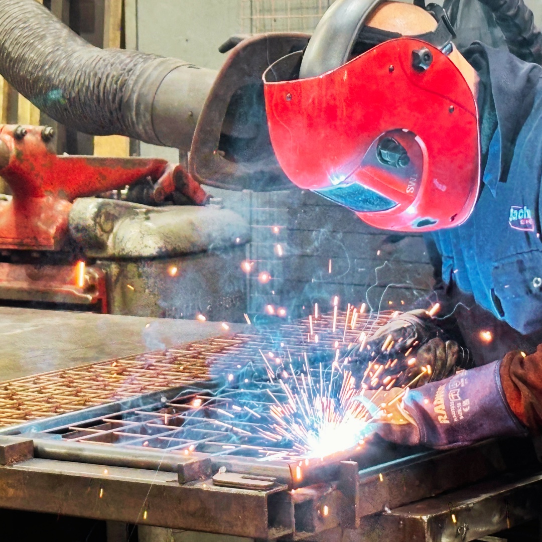 Bache Pallets welder fabricating a steel mesh assembly